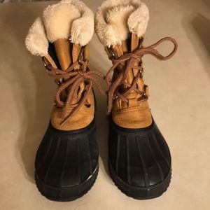 Lace up brown boots with rubber soles